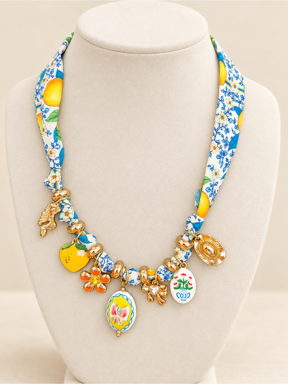 Gold-Tone Floral Charm Necklace with Yellow and Blue Fabric